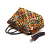 A large, colorful women's handbag, perfect for travel