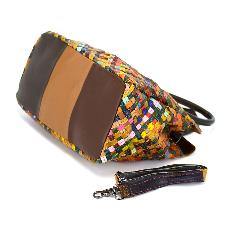 A large, colorful women's handbag, perfect for travel