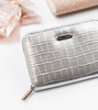 A handy women's wallet with a crocodile skin pattern